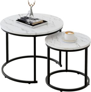 Modern set of two white marble nesting coffee tables with black metal frame in a contemporary living room.