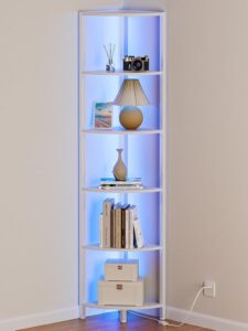 White six-tier corner shelf with LED lights displaying books, plants, and decorative accessories in a modern living room.