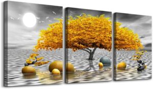 Three-piece abstract tree canvas wall art with golden leaves displayed above a living room sofa.