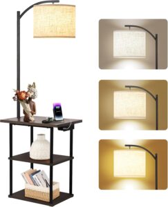 Text: Modern floor lamp with wooden shelves and beige fabric shade beside a sofa in a contemporary living room.