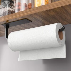 Black under cabinet paper towel holder mounted beneath a wooden kitchen cabinet holding a paper towel roll